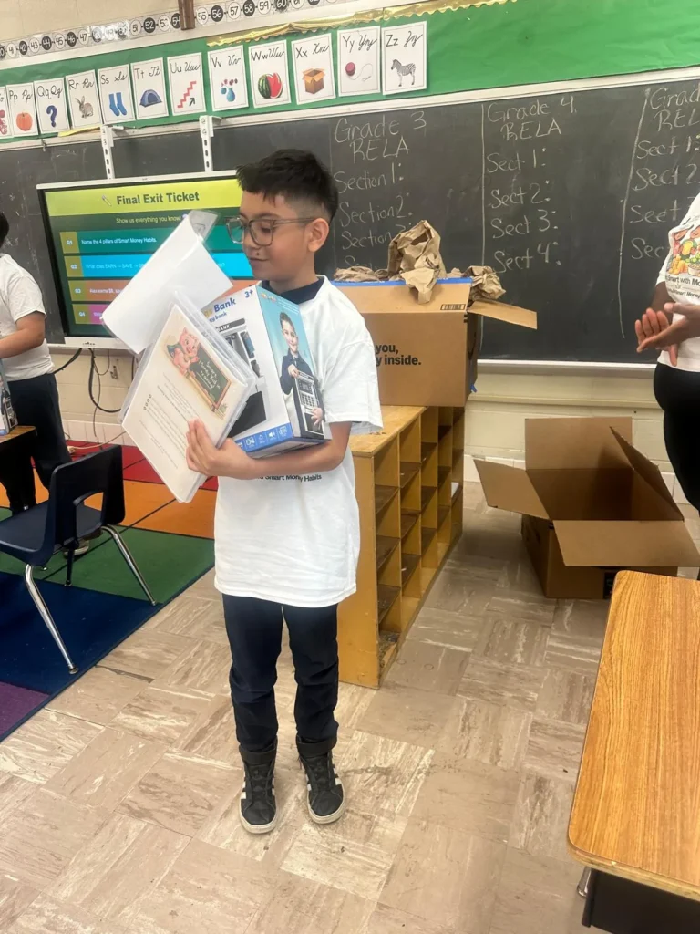 Elementary students participating in a financial literacy lesson